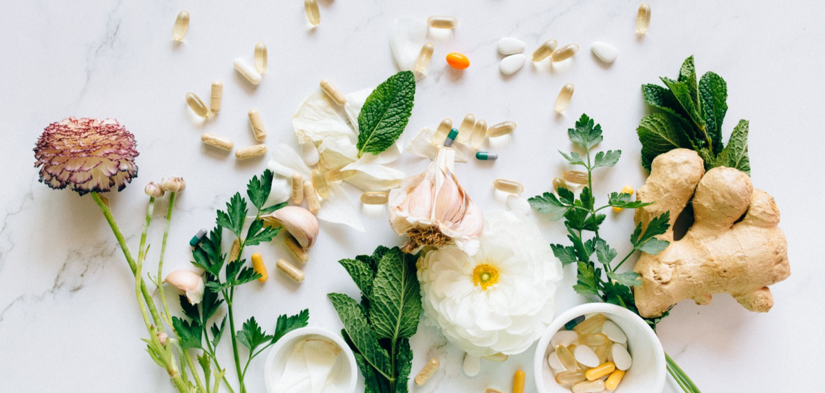 Natural wellness capsules on a wooden surface, representing intentional microdosing with Medicine Box